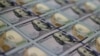 WASHINGTON, DC - MAY 20: Newly redesigned $100 notes lay in stacks at the Bureau of Engraving and Printing on May 20, 2013 in Washington, DC. 