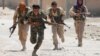 Kurdish fighters from the People's Protection Units (YPG) battle in Raqqa in July