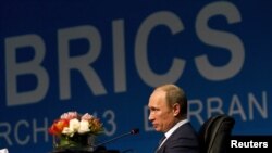 Russian President Vladimir Putin speaks during closing remarks at the fifth BRICS Summit in Durban, South Africa.