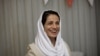 Iranian lawyer Nasrin Sotoudeh smiles at her home in Tehran on September 18, 2013