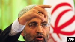 Said Jalili takes questions at a press conference at the Iranian Embassy in Beijing.