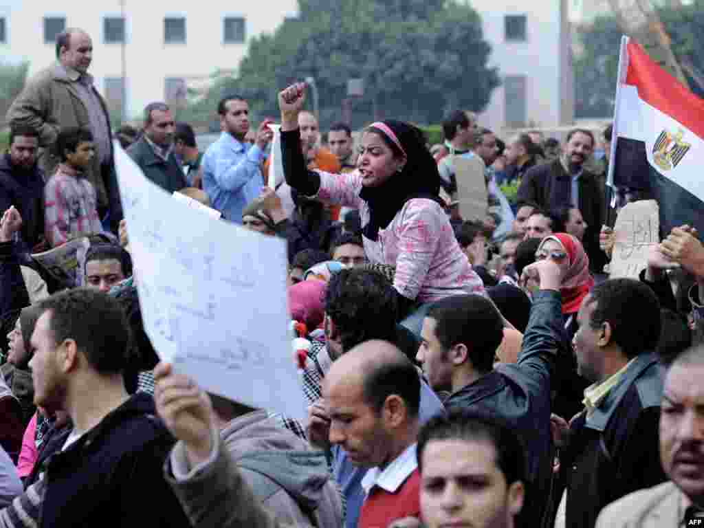 Protesters shout slogans against Mubarak's regime.