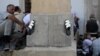 Kosovar Muslims pray outside the grand mosque compound during the first Friday Prayers of the Muslim holy month of Ramadan in Pristina on July 20. (AFP/Armend Nimani)