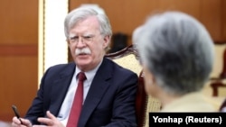 SOUTH KOREA -- U.S. National Security Adviser John Bolton talks with South Korean Foreign Minister Kang Kyung-wha at the Foreign Ministry in Seoul, South Korea, July 24, 2019. 