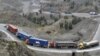 Cargo trucks drive through the mountainous area near Torkham by Afghanistan's border with Pakistan. (file photo)