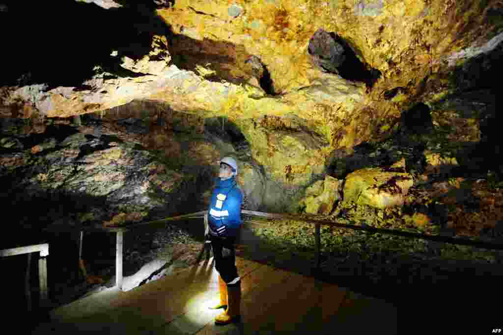 An employee for the local subsidiary of Gabriel Resources visits a Roman-era gold mine in Rosia Montana. Protesters fear the company&#39;s mining plans will wipe out centuries of mining heritage. (AFP/Daniel Mihailescu)