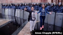 ARMENIA -- The scene as night fell on Republic Square in Yerevan, rings of police guarding a government building,