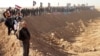 Demonstrators protest outside Camp Ashraf, home to exiled Iranian opposition members, in Iraq's Diyala province on December 9.