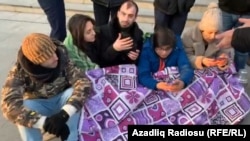 Protesters wrapped in blankets were staging a sit-in Baku when riot police detained all participants.