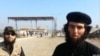Скриншот видео, герой которого представляется Абу Умарионом, этническим таджиком, отправившимся в Сирию для вступления в ряды ИГ.