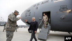 Germany -- US Secretary of Defense Chuck Hagel (C) is greeted by US General Philip Breedlove, US Air Force Commander for Europe (L) upon Hagel's arrival from Afghanistan at Ramstein Air Base, 11Mar2013