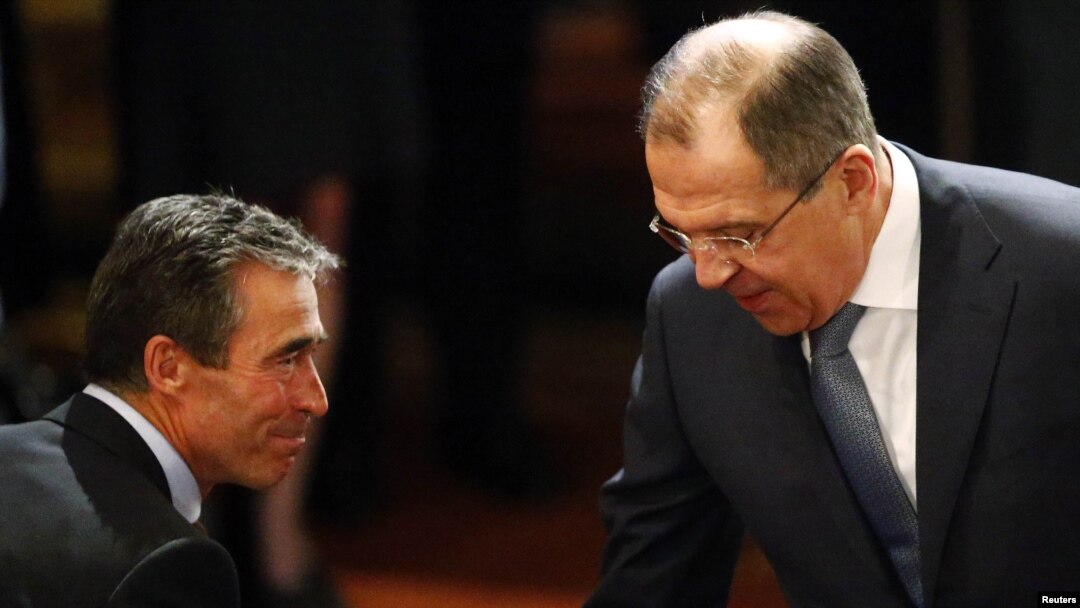 Russian Foreign Minister Sergei Lavrov (right) and NATO Secretary-General Anders Fogh Rasmussen meet at the 49th Conference on Security Policy in Munich on February 2.