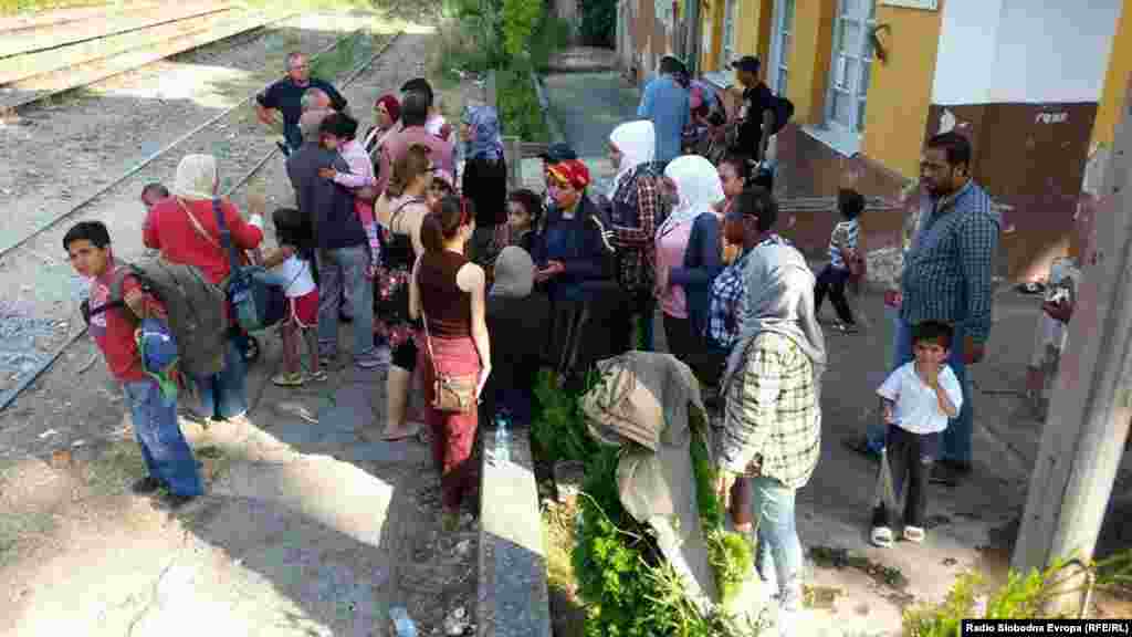 Migrants wait at the train station in Demir Kapija to try to board a train to Serbia. As unauthorized migrants, they are officially forbidden from using public transportation. 