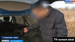 A man identified as Vladimir shows Bira TV reporters how he folded down the backseats of his car so he could transport his aunt's dead body to the morgue.