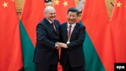Belarusian President Alyaksandr Lukashenka (left) meets with China's President Xi Jinping on the sidelines of the Shanghai Cooperation Organization leaders' summit in Samarkand, Uzbekistan, in September. 
