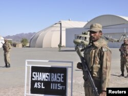 Pakistani soldiers stand guard at Shamsi Airfield in southwestern Pakistan.