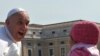 VATICAN -- Pope Francis salutes a young girl as he arrives for his weekly general audience at St Peter's square on 24Apr2013 at the Vatican. 
