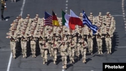 Armenia - Armenian soldiers carry U.S., German, Italian, Polish and Greek flags during a parade in Yerevan, 21Sep2016.