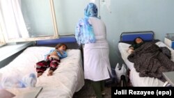 Afghans who were injured in a U.S. air strike receive medical treatment at a hospital in Herat in August.