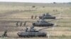 UKRAINE - Pro-Russian separatist tanks take part in a military exercise on a shooting range near Luhansk on eastern Ukraine on June 25. 