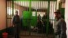 Prison wardens stand guard during a visit by local and international media at Pul-e Charkhi prison on the outskirts of Kabul