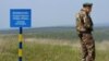 A Ukrainian border guard near one of 150 posts set up by Ukraine along its border with Moldova's breakaway region of Transdniester