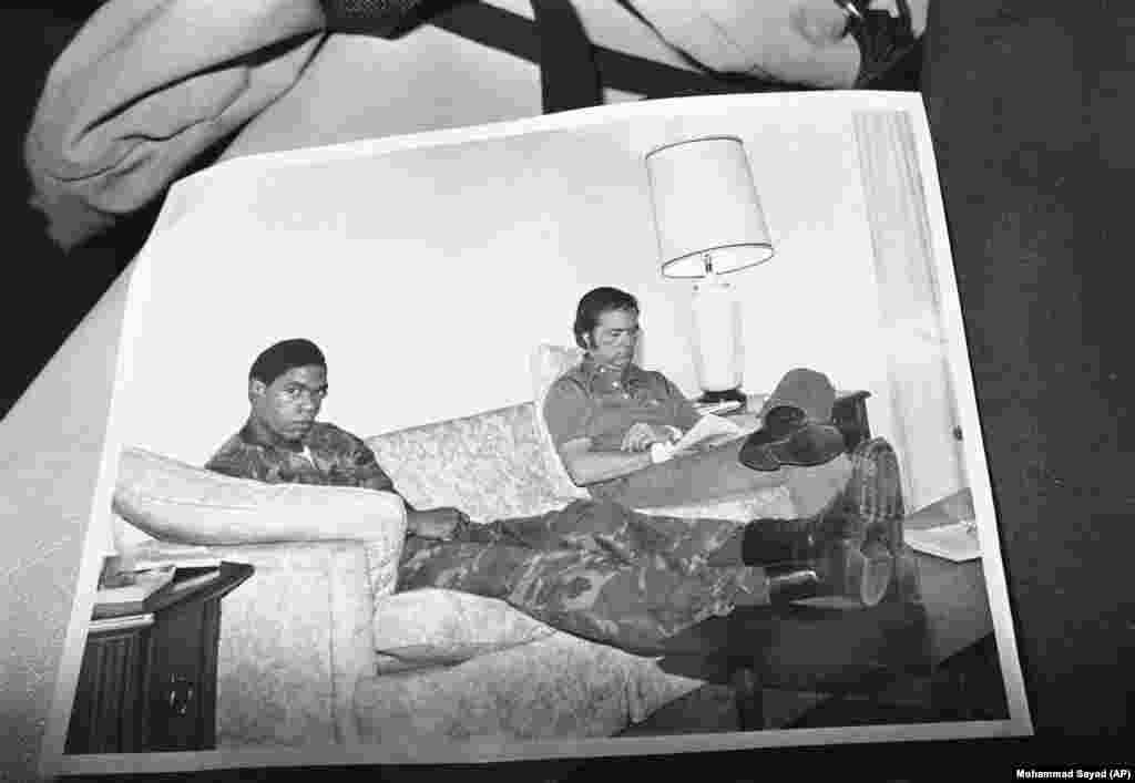 The Iranian captors took pains to show the American hostages looking comfortable. This image of an embassy staffer and a U.S. Marine was presented at a Tehran news conference on November 9, 1979. But the outside world had almost no access to the captives and, in reality, they struggled to cope. They endured beatings, a mock execution, and two would attempt suicide.