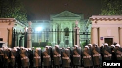 Riot police formed a cordon in front of the Russian embassy during the march.