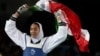 Iran's Kimia Alizadeh celebrates after winning the bronze medal in women's taekwondo at the 2016 Summer Olympics in Rio de Janeiro.