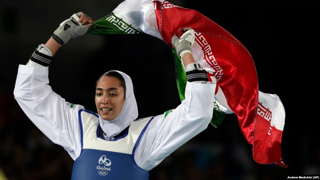 Iran's Kimia Alizadeh celebrates after winning the bronze medal in women's taekwondo at the 2016 Summer Olympics in Rio de Janeiro.