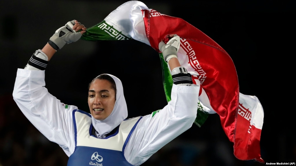 Kimia Alizadeh of Iran celebrates after winning the bronze medal in women's taekwondo at the 2016 Summer Olympics in Rio de Janeiro.