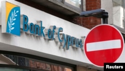 A no entry sign outside a branch of the Bank of Cyprus UK in central London.