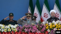 Iranian President Hassan Rohani (right) and Revolutionary Guard commander Mohammad Ali Jafari (left) attend the annual military parade marking the Iraqi invasion in 1980 in Tehran in September.
