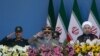 President Hassan Rohani (R), Armed Forces chief Hassan Firouzabadi (C) and Revolutionary Guard commander Mohammad Ali Jafari (2-L), attend the annual military parade marking the 1980 Iraqi invasion, September 22, 2014