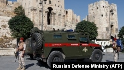 SYRIA -- Russian military police patrol outside the medieval Citadel of Aleppo, September 13, 2017