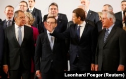 Russian Foreign Minister Sergei Lavrov (left) and U.S. Secretary of State Rex Tillerson (far right) at the OSCE's Ministerial Council gathering on December 7. Also pictured: OSCE Secretary General Thomas Greminger (second left) and Austrian Foreign Minister Sebastian Kurz (second right)