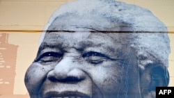 A portrait of anti-apartheid icon Nelson Mandela hung outdoors at the Shanghai World Expo 2010. 
