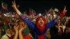 Supporters of Imran Khan, head of Pakistan Tehrik-e-Insaf (PTI) political party listen to his speech, during an election campaign in Karachi, Pakistan on July 22.