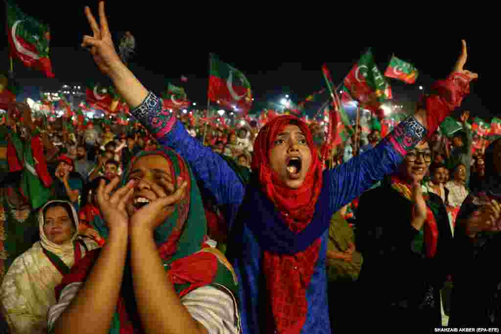 Supporters of Imran Khan, the head of the Pakistan Tehrik-e-Insaf (PTI) political party, listens to his speech during an election campaign in Karachi. Pakistan is set to hold general and provincial elections on July 25 with around 105 million people registered to vote. (EPA-EFE/Shahzaib Akber)