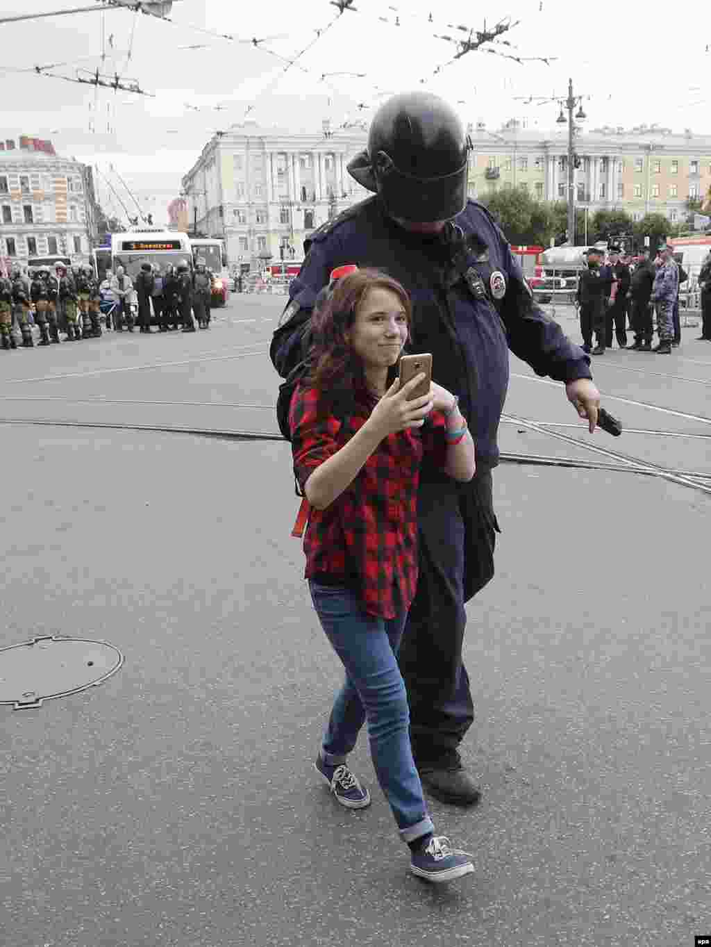 A young protester being detained in St. Petersburg.&nbsp;