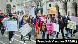 Demonstrators protest on the National Mall in Washington, D.C., for the Women's March on January 21. Hundreds of thousands of protesters spearheaded by women's rights groups demonstrated across the U.S. and in cities around the world.