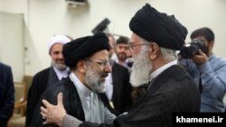 Iranian Supreme Leader Ali Khamenei (R) and head of Judiciary Ebrahim Raeesi. File photo