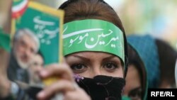 A supporter of Iranian presidential candidate Mir Hossein Musavi in Tehran, June 2009