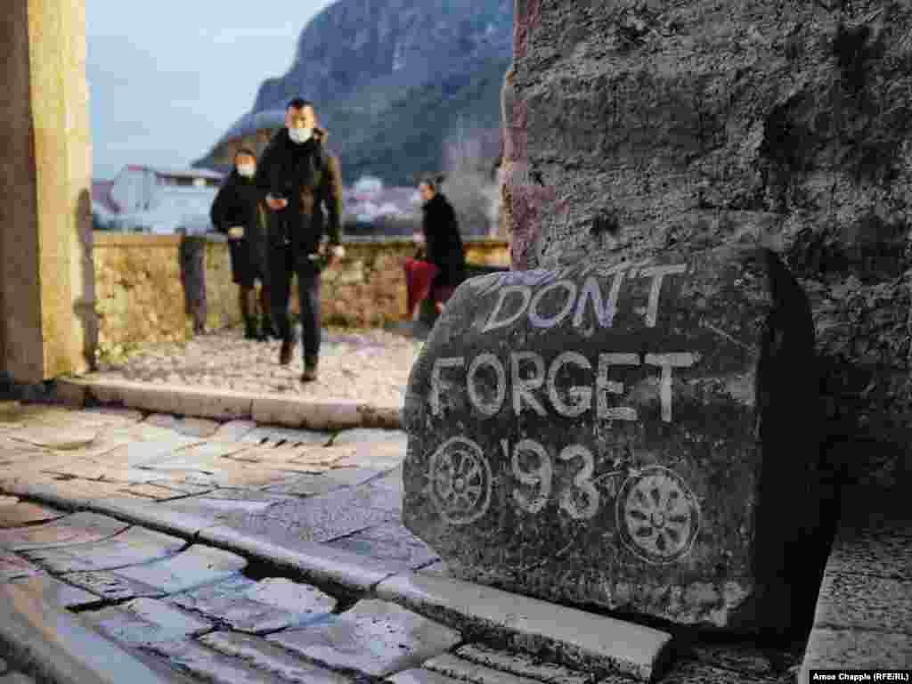 A stone at the entrance to Mostar’s iconic Old Bridge references the year when the 16th-century Ottoman structure was destroyed by Croatian fighters. The bridge was rebuilt in the 2000s. 