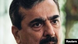 Pakistani Prime Minister Yusuf Raza Gilani speaks during an interview with Reuters at his residence in Islamabad on September 27.