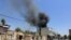 Smoke billows from the site of a suicide attack during ongoing fighting between Afghan security force and militants in Jalalabad on July 31.