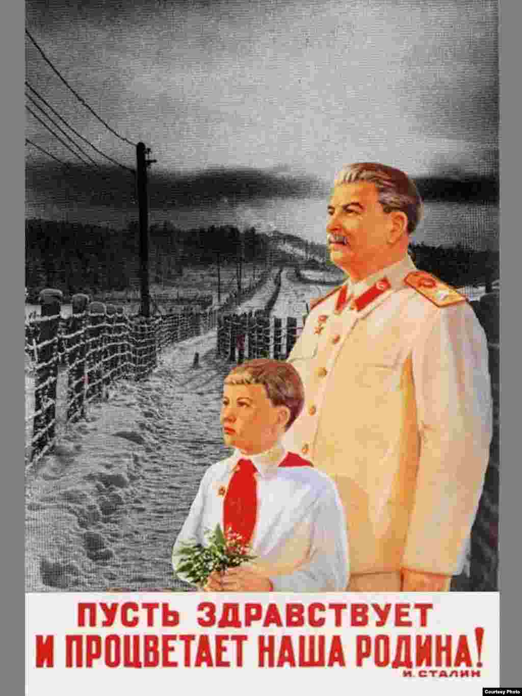 This poster, stating "Let the motherland prosper and bloom," superimposes Stalin and a young supporter on a prison camp. - Before the 65th anniversary in May of the end of World War II in Europe, some Russian leaders encouraged renewed pride in Stalin's role in the defeat of fascism. A bus decorated with Stalin's image toured St. Petersburg, while a plan to display posters of the dictator in Moscow was scuttled only at the last minute. Poster by Valdimir Potapov
