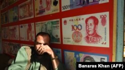 A Pakistani currency dealer waits for the customer in the southwestern city of Quetta.