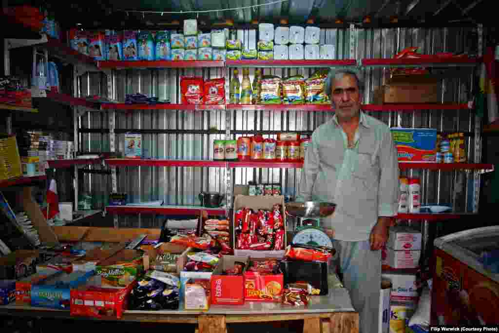 Work opportunities in Akre are very limited. To cater for the camp&#39;s needs, a Syrian refugee has set up a small shop within the fortress. A wide variety of basic goods are stocked in the tin shack, such as rice, cooking oil, cigarettes, and hygiene products.