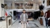 FILE: Owner of a luxury clothes shop Sohail Ataie, 22, poses for a picture in Kabul in January.